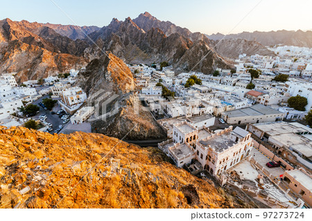 Mutrah Sunset. Cityscape View of Muscat at Beautiful Sunset. The Capital of Oman. Arabian Peninsula. 97273724