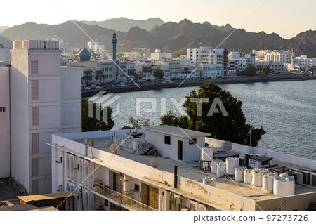 Mutrah Sunset. Cityscape View of Muscat at Beautiful Sunset. The Capital of Oman. Arabian Peninsula. 97273726