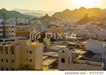 Mutrah Sunset. Cityscape View of Muscat at Beautiful Sunset. The Capital of Oman. Arabian Peninsula. 97273727