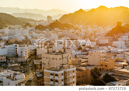 Mutrah Sunset. Cityscape View of Muscat at Beautiful Sunset. The Capital of Oman. Arabian Peninsula. 97273728