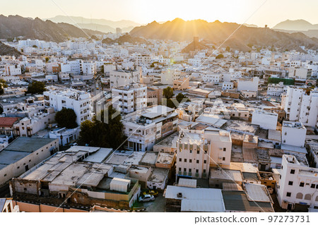 Mutrah Sunset. Cityscape View of Muscat at Beautiful Sunset. The Capital of Oman. Arabian Peninsula. 97273731