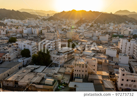 Mutrah Sunset. Cityscape View of Muscat at Beautiful Sunset. The Capital of Oman. Arabian Peninsula. 97273732