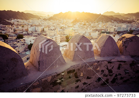 Mutrah Sunset. Cityscape View of Muscat at Beautiful Sunset. The Capital of Oman. Arabian Peninsula. 97273733