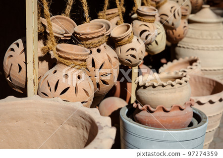 Hand Made Pottery in Nizwa Market. Clay Jars at the Rural Traditional Arabic Bazaar, Oman.  97274359
