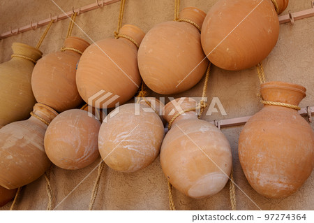 Hand Made Pottery in Nizwa Market. Clay Jars at the Rural Traditional Arabic Bazaar, Oman. Hand Made Pottery in Nizwa Market. Clay Jars at the Rural Traditional Arabic Bazaar, Oman. 97274364