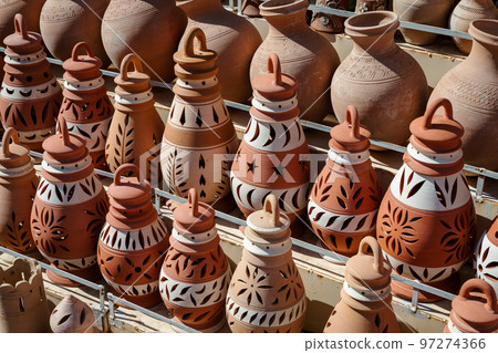 Hand Made Pottery in Nizwa Market. Clay Jars at the Rural Traditional Arabic Bazaar, Oman. Hand Made Pottery in Nizwa Market. Clay Jars at the Rural Traditional Arabic Bazaar, Oman. 97274366