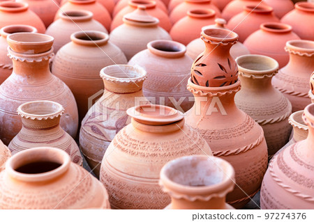 Hand Made Pottery in Nizwa Market. Clay Jars at the Rural Traditional Arabic Bazaar, Oman. Hand Made Pottery in Nizwa Market. Clay Jars at the Rural Traditional Arabic Bazaar, Oman. 97274376