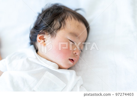 A baby taking a nap. A baby taking a nap. 97274403
