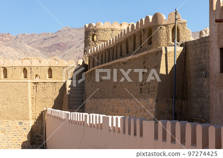 Nizwa city walls. Traditional medieval architecture in Nizwa, Oman.  97274425