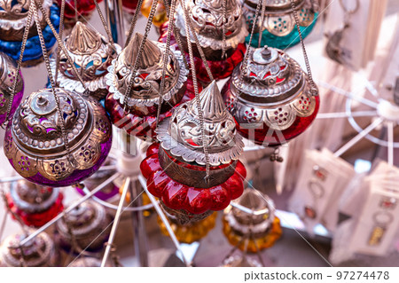 Souvenirs exhibited in market shops of the old town Nizwa. Oman. Arabian Peninsula. Souvenirs exhibited in market shops of the old town Nizwa. Oman. Arabian Peninsula. 97274478
