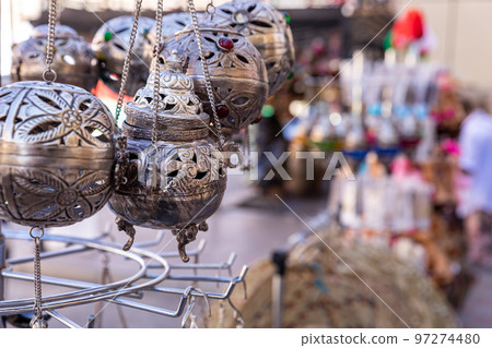 Souvenirs exhibited in market shops of the old town Nizwa. Oman. Arabian Peninsula. Souvenirs exhibited in market shops of the old town Nizwa. Oman. Arabian Peninsula. 97274480