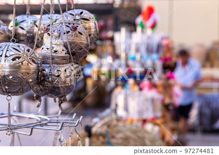 Souvenirs exhibited in market shops of the old town Nizwa. Oman. Arabian Peninsula. Souvenirs exhibited in market shops of the old town Nizwa. Oman. Arabian Peninsula. 97274481