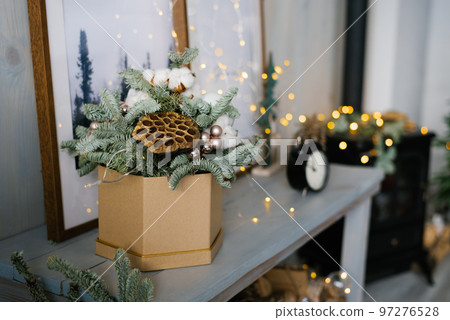Christmas composition of fir branches, Christmas balls and cotton bolls. Selective focus. Copy space. Christmas composition of fir branches, Christmas balls and cotton bolls. Selective focus. Copy space. 97276528