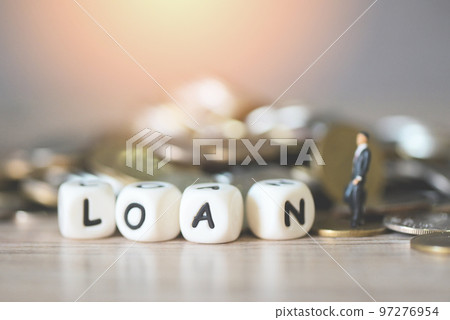 Loan business economy concept of money and finance, on table, Loan business finance economy and business man standing on a coin on wooden table background 97276954