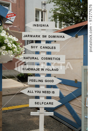 Street signs commercial and cultural event named dominic's fair or Jarmark. Main Town every August. Dominic's Fair in Gdansk and shots of the streets 97277676