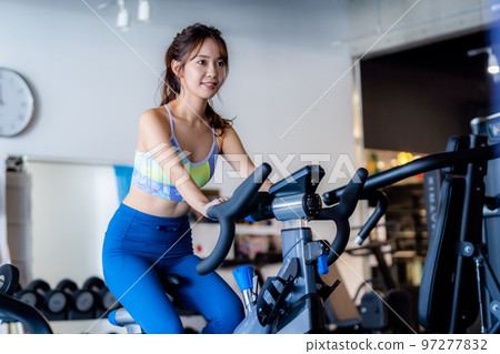 Young woman training in a sports gym 97277832