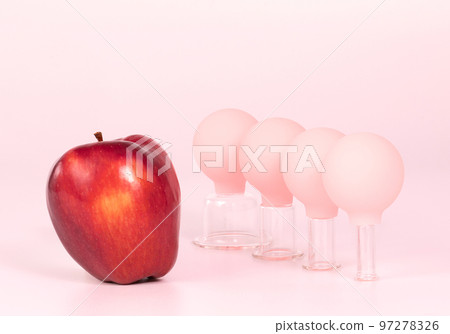 Glass jars for face vacuum massage. Cosmetology and face fitness concept Glass jars for face vacuum massage. Cosmetology and face fitness concept 97278326