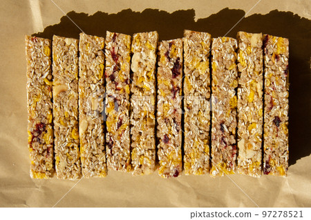 Homemade Granola energy bar. Variety of homemade protein granola breakfast bars, with nuts, raisins dried cherries and chocolate. Healthy nutrition eating Gluten free cereal dieting snack super food 97278521