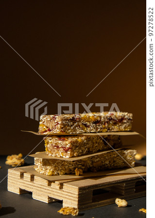 Homemade Granola energy bar. Variety of homemade protein granola breakfast bars with nuts, raisins dried cherries and chocolate. Healthy nutrition eating Gluten free cereal dieting snack super food 97278522