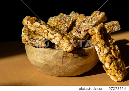 Homemade Granola energy bar. Variety of homemade protein granola breakfast bars with nuts, raisins dried cherries and chocolate. Healthy nutrition eating Gluten free cereal dieting snack super food Homemade Granola energy bar. Variety of homemade protein granola breakfast bars with nuts, raisins dried cherries and chocolate. Healthy nutrition eating Gluten free cereal dieting snack super food 97278534