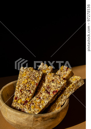Homemade Granola energy bar. Variety of homemade protein granola breakfast bars with nuts, raisins dried cherries and chocolate. Healthy nutrition eating Gluten free cereal dieting snack super food 97278536