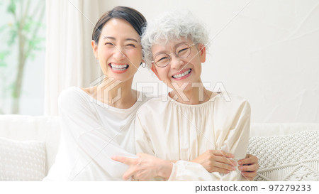 Senior middle-aged woman with a smile, elderly mother and daughter 97279233