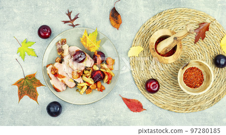 Pork shoulder baked with vegetables and plums. Pork shoulder baked with vegetables and plums. 97280185