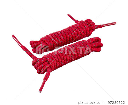 Pair red polyester laces for sports shoes, rolled into bobbins, insulated on a white background. 97280522