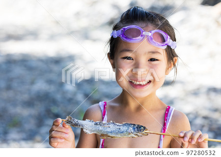 Children enjoying playing in the river Children enjoying playing in the river 97280532
