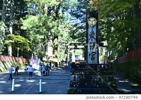 Shrine sign and stone torii on the approach to Nikko Toshogu Shrine Shrine sign and stone torii on the approach to Nikko Toshogu Shrine 97280749