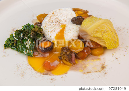 Recipe for braised cabbage, multicoloured carrots, onions, chanterelle mushrooms, poached egg and Recipe for braised cabbage, multicoloured carrots, onions, chanterelle mushrooms, poached egg and 97281049