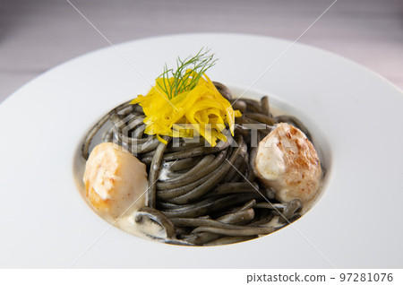 Recipe for Linguine Pasta with squid ink and scallops, yellow chioggia beet Recipe for Linguine Pasta with squid ink and scallops, yellow chioggia beet 97281076