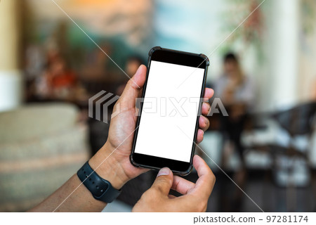 technology and social concept - Hand holding mobile phone with blank screen. technology and social concept - Hand holding mobile phone with blank screen. 97281174