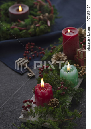 Christmas wreath and candle black background Christmas wreath and candle black background 97283475