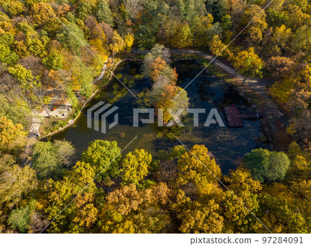 Dabrowa Gornicza Aerial View. Park Zielona ( Green Park ) at Autumn Time. Top Down View of Autumn Forest with Green and Yellow Trees. Upper Silesia Province, Poland. Dabrowa Gornicza Aerial View. Park Zielona ( Green Park ) at Autumn Time. Top Down View of Autumn Forest with Green and Yellow Trees. Upper Silesia Province, Poland. 97284091