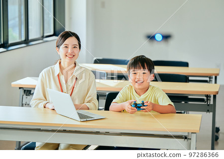 Elementary school boy operating a drone 97286366