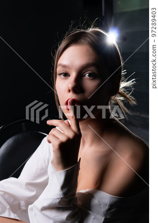 female model portrait quietly elegance beauty sign attractive posing studio makeup hairstyle 97289403