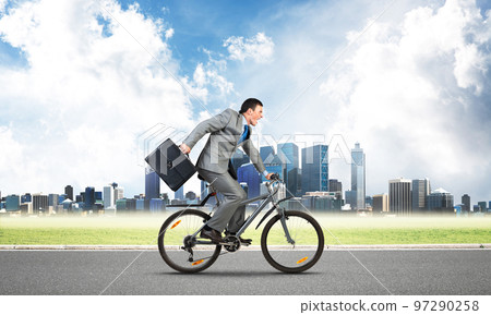 Man riding bicycle on highway 97290258