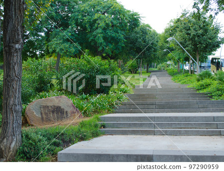 Staircase road in a beautiful Park, trees, rocks Staircase road in a beautiful Park, trees, rocks 97290959