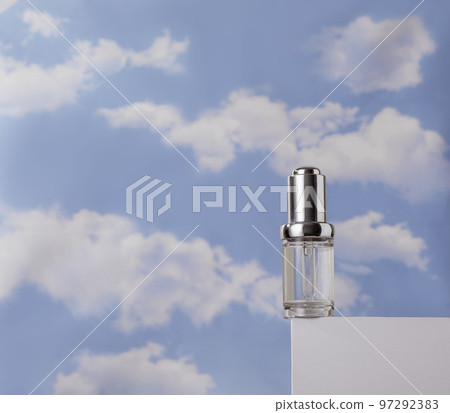 Transparent serum on white podium against cloudy blue sky. Concept of lightness of cosmetics Transparent serum on white podium against cloudy blue sky. Concept of lightness of cosmetics 97292383
