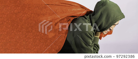 man in a green hoodie with a huge red bag on his back delivers Christmas gifts on a white background 97292386