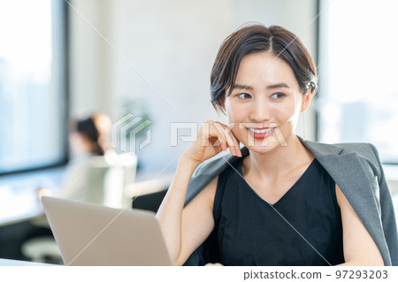 Woman working in coworking space Woman working in coworking space 97293203