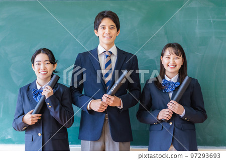 High school student with diploma in classroom 97293693