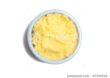Ghee in a butter dish isolate on a white background.Top view. Ghee in a butter dish isolate on a white background.Top view. 97294308