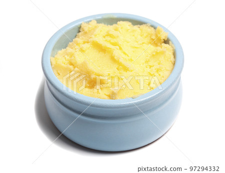 Ghee in a butter dish isolate on a white background Ghee in a butter dish isolate on a white background 97294332
