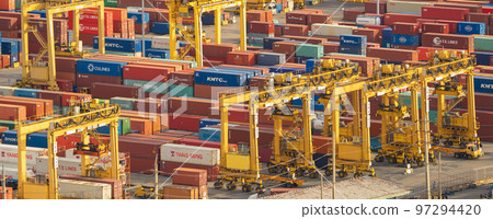 Aerial view of container cargo ship in the export and import business and logistics international goods in urban city. Shipping to the harbour by crane in Bangkok harbour, Thailand. Aerial view of container cargo ship in the export and import business and logistics international goods in urban city. Shipping to the harbour by crane in Bangkok harbour, Thailand. 97294420