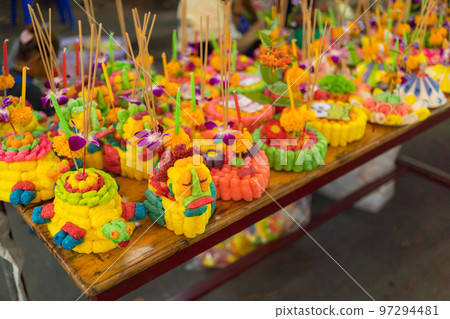 Loy Krathong in Thailand , floating on water in local street market festival. Celebration and Culture. People holiday at night. Thai event. it made by banana leaf. 97294481