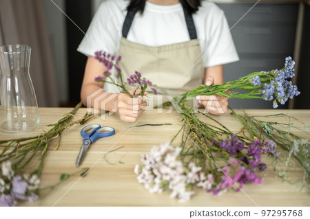 Weekend with her hobbies, Asian woman arranges a bouquet of flowers to decorate her home and beautify, Artificial flower arrangement, living room decoration ideas, Flowers bunch, Arts and crafts Weekend with her hobbies, Asian woman arranges a bouquet of flowers to decorate her home and beautify, Artificial flower arrangement, living room decoration ideas, Flowers bunch, Arts and crafts 97295768
