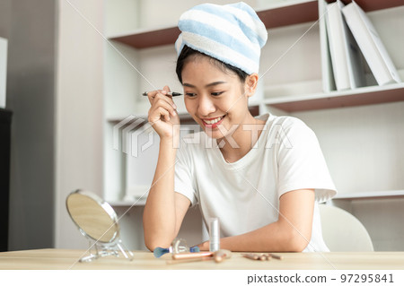 Half Japanese woman putting on makeup and hair to prepare for work in the morning, Facial care and cosmetics, Make up mirror, Take a shower and put on make-up and get dressed and ready to go to work Half Japanese woman putting on makeup and hair to prepare for work in the morning, Facial care and cosmetics, Make up mirror, Take a shower and put on make-up and get dressed and ready to go to work 97295841