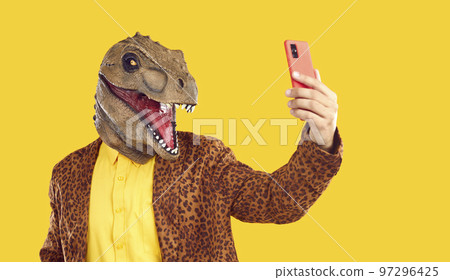 Portrait of a funny showman in a leopard suit and yellow shirt. 97296425